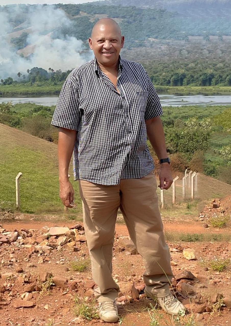 Ben Kijuu standing in the Kenyan landscape